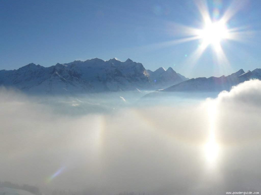 Inversion over the Bernese Oberland with halo effect (reflection of the sun)