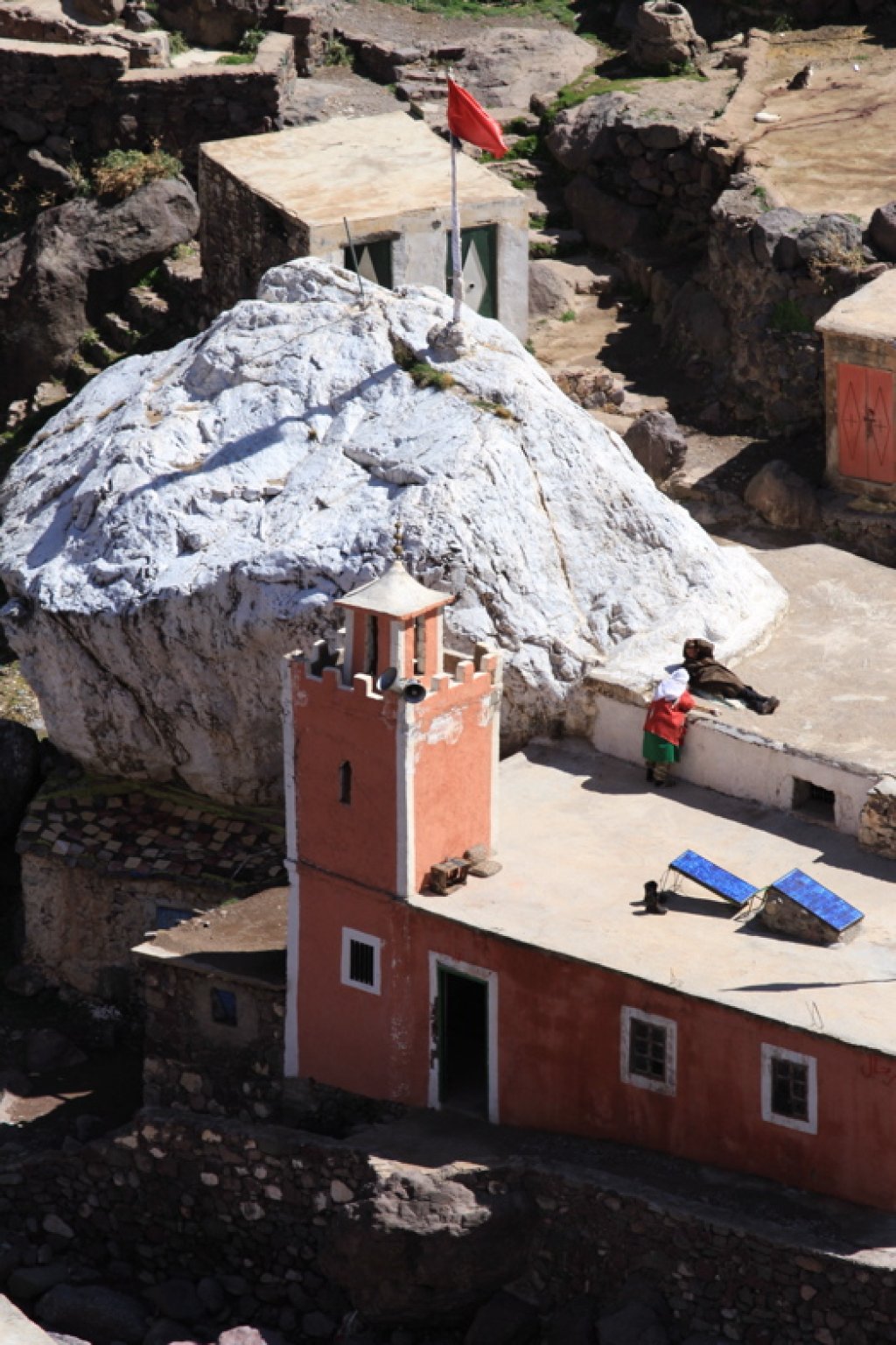 The Sidi Chammharouch monastery with its white-painted rock, which nobody really knows why it is white at all.