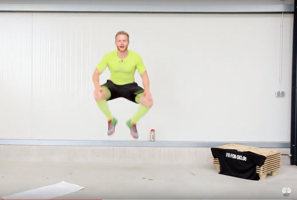 Box jump two: Jump straight up, knees touching hands.