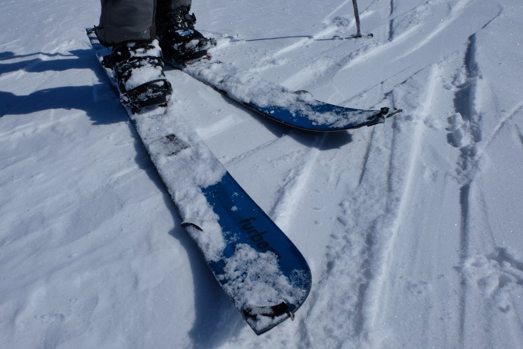 Snow definitely sticks to the ski parts