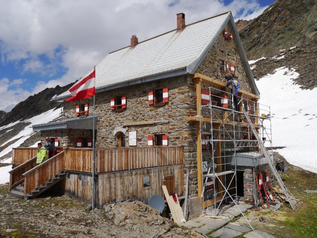 Unstable foundations and dilapidated high-wilderness house due to thawing permafrost